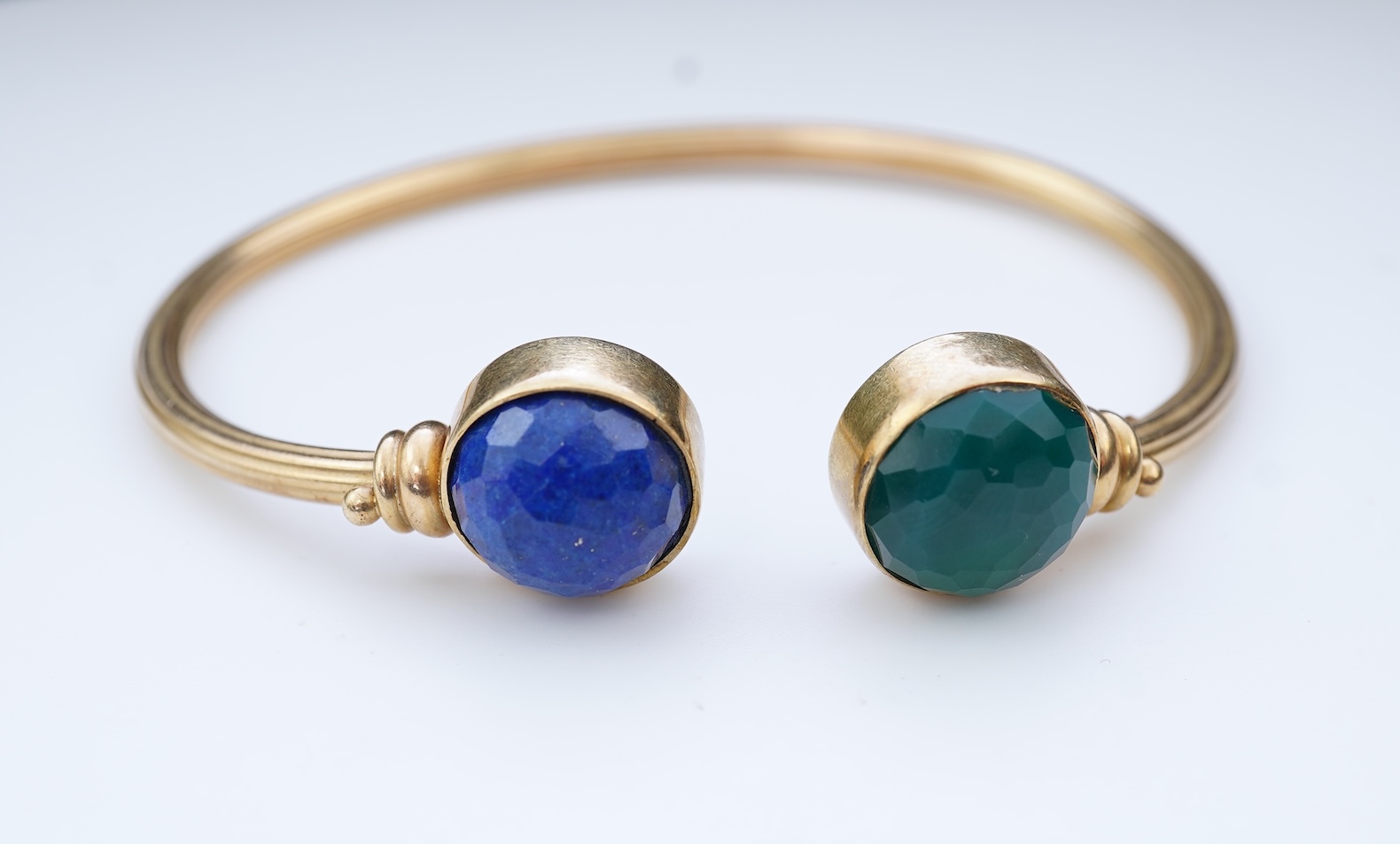 A gold, lapis lazuli and green chalcedony bangle